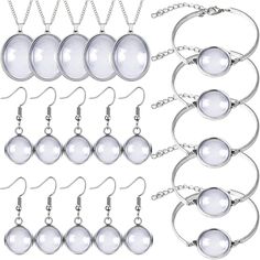 an assortment of jewelry with chains and pendants on white background, all in different shapes and sizes