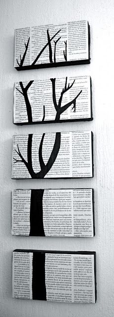 three black and white trees are hanging on the wall next to each other, one is made out of an old book