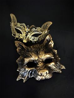 Embark on an enchanting journey with our gold couples masquerade mask set featuring a stunning laser-cut metal fox mask adorned with rhinestones for her, and a powerful wolf mask for him. Together, you'll create an unforgettable duo at any masquerade party, ball, and other elegant events!


Age Group/Gender - Adult/Unisex

Size/Type - One size fits all adults

Mask Color - Gold

Mask Material - Laser-cut metal fox, polyresin wolf

Accent Material - Paint

Special Features - Rhinestones on the wo Ball Room Mask, Couples Masquerade Masks, Golden Roses, Wolf Mask, Fox Mask, Female Mask, Gold Mask, Laser Cut Metal, Masks Masquerade