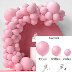 pink balloons are arranged in the shape of a letter