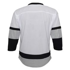 Help your young fan show everyone how proud they are to be a Los Angeles Kings fan when you grab them this 2021/22 Alternate Replica Jersey. Featuring crisp Los Angeles Kings graphics, this will be the go-to jersey for your kiddo on game day! Add this sweet gear to their Los Angeles Kings collection today. Brand: Outerstuff Imported Machine wash Material: 100% Polyester NHL team graphics printed on front Officially licensed Screen print name and numbers on back Woven jock tag above left hem Sports Fan Cotton Jersey With Team Logo, Cotton Team Jersey Fan Apparel, Varsity Cotton Jersey With Team Logo, Sports Fan Cotton Jersey With Letter Print, Cotton Fan Apparel Jersey With Team Name, Sports Fan Cotton Jersey With Team Name, Collegiate Cotton Jersey For Fan Gear, Cotton Team Jersey For Streetwear, Collegiate Cotton Jersey For Fans