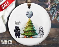 a star wars christmas tree ornament with an image of darth vader and stormtrooper