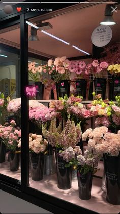 a display case filled with lots of different types of flowers