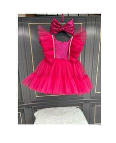 Introducing our stunning Fuchsia Pink Dress - the perfect personalized birthday fuchsia puffy dress with sequins for your little princess. This exquisite birthday tutu outfit is a hot pink dress for baby girls, designed to make her special day unforgettable. Our fuchsia princess dress features dense tulle layers and a comfortable cotton lining, ensuring both beauty and comfort. The big bow dress, adorned with sparkling sequins, is our crown gift, ideal for birthday gifts and other special occasi Fuchsia Pink Dress, Big Bow Dress, Dress For Baby Girl, Baby Party Dress, Hot Pink Dress, Birthday Tutu Outfit, Puffy Dresses, Dress With Sequins, Tutu Outfits