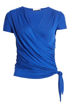 A faux-wrap front flatters on this soft and versatile jersey top cinched with a saucy tie at the hip. 23 1/2" length Surplice V-neck Short sleeves 95% rayon, 5% spandex Machine wash, dry flat Imported Women's Clothing Blue Wrap Top, Faux Wrap Top, Jersey Top, Wrap Top, Women's Clothing, Short Sleeves, Nordstrom, V Neck, Mens Tshirts