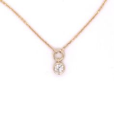 14k yellow gold diamond solitaire necklace. This 1mm diamond cut cable chain features a genuine .33 carat round brilliant bezel set diamond drop set below a solid stationary circle attached. Diamond quality is SI2 clarity G-H color. Chain length is 16 inches. 3 Carat Diamond, 16 Inch Necklace, Solitaire Necklace, Handmade Fine Jewelry, Diamond Solitaire Necklace, Solitaire Necklaces, Bezel Set Diamond, Diamond Settings, Diamond Drops