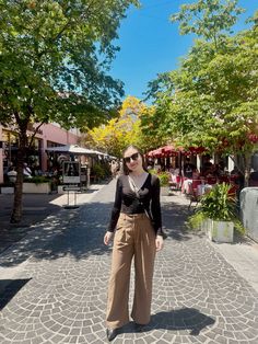 Petite outfit of the day for a Sunday at the Wolfsonian Museum, South Beach, Miami: black long sleeved shirt, chocolate brown, petite, high waisted pleated dress pants, paired with black pointed toe stiletto pumps and black and gold accessories 🤎🖤✨

Black and brown outfits | neutrals | warm neutrals | monochromatic outfit | neutral earth tones | black and brown clothing | women's dress pants | women's work pants | chocolate brown dress pants | women's slacks | brown slacks | petite pants | petite dress pants | petite trousers | sunday outfit Miami Beach | coffee shop outfit | art museum outfit | business casual outfit | interview outfit | coffee shop aesthetic | soft aesthetic | Espanola Way Miami Beach | South Beach | South Beach photography

#petitefashion Brown Trousers Outfit Women, Brown Trousers Outfit, Neutral Monochromatic Outfit, Chocolate Brown Dress, Petite Dress Pants, Dress Pants Outfits, Chocolate Brown Color, Work Pants Women, Brown Dress Pants