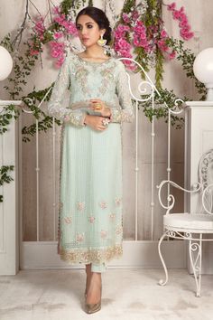 Add style to your wardrobe with this mint no., over a canvas of embroidered chiffon featuring floral embroidery in dabka, naqshi, pearls and beads. Hand crafted tassel and loop button details on side hem for additional style quotient. This stunning shirt is paired with straight pant and sequin embellished dupatta with 3d floral details to complete the look. Shirt Fabric: Pure Embroidered ChiffonShirt Length: 48”Pant Fabric: Pure Raw SilkDupatta Fabric: Pure ChiffonShirt ,Pant & Dupatta Color Eid Embellished Pista Green Kurta, Elegant Pista Green Kurta With Floral Embroidery, Embellished Pista Green Kurta For Wedding, Pista Green Embellished Kurta For Wedding, Embellished Pista Green Salwar Kameez For Eid, Designer Embellished Kurta For Spring, Spring Designer Embellished Kurta, Embellished Pista Green Georgette Dress, Pista Green Embellished Georgette Dress