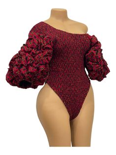 Experience the vibrant culture of Africa with our African Print Ruffle Sleeves Bodysuit in red. Made from high-quality fabric, this bodysuit features beautiful ruffle sleeves and a striking African print. Embrace your unique style with this bold and fashionable piece. Fitted Long Sleeve Ruched Bodysuit, Fitted One-piece Bodysuit With Ruffles, Fitted Ruffles Bodysuit, Stretch Ruffles Bodysuit For Party, Stretch Ruffle Bodysuit For Party, Stretch Ruffled Bodysuit For Party, Fitted Long Sleeve Bodysuit With Ruffles, Stretch Bodysuit With Puff Sleeves, Red Fitted One-piece Bodysuit