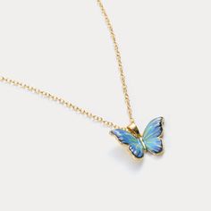 Adorn yourself in this Blue Butterfly Necklace, a stunning embodiment of transformation and beauty, featuring a delicately crafted butterfly pendant in vibrant shades of blue and gold. The intricate details of the wings are highlighted by the luminous enamel finish, creating a striking contrast against the elegant gold chain. This necklace exudes a sense of lightness and grace, making it a perfect accessory for adding a touch of whimsy and sophistication to any outfit. Ideal for those who cheris Elegant Blue Butterfly Jewelry, Elegant Turquoise Butterfly Jewelry, Dainty Blue Butterfly Jewelry, Turquoise Butterfly Charm Jewelry Gift, Blue Butterfly Necklace For Gifts, Blue Butterfly Necklace For Gift, Gold Butterfly Print Jewelry For Gift, Gold Jewelry With Butterfly Print For Gift, Blue Butterfly Jewelry With Butterfly Print