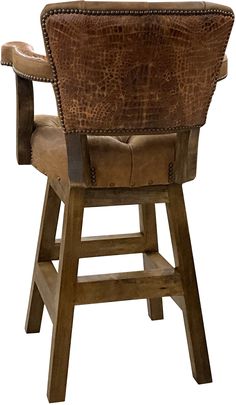 an upholstered leather chair with wooden legs and back rests against a white background