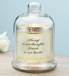 an empty glass bottle sitting on top of a table