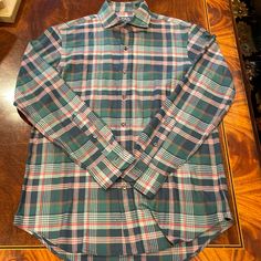 New. Never Worn. Polo By Ralph Lauren Green Plaid Lightweight Flannel Button Down Shirt. Quality Classic Fit Cotton Shirt Has Ralph Lauren Buttons And Collar Stays. Rugged Looking Plaid Has Different Shades Of Green With Navy, Tan, And Red/Rust Accents - Muted Neutral Colors. Perfect For Fall! Lightweight Material Is So Soft And Can Be Worn Solo Or Under A Sweater Or Vest. Versatile And Classic! Plaid Cotton Flannel Shirt With Casual Collar, Casual Plaid Cotton Dress Shirt, Green Shirt With Button Cuffs And Spread Collar, Plaid Cotton Dress Shirt With Spread Collar, Casual Plaid Collared Dress Shirt, Casual Green Cotton Dress Shirt, Green Cotton Flannel Shirt With Button Closure, Casual Plaid Button-up Dress Shirt, Green Casual Button-up Dress Shirt