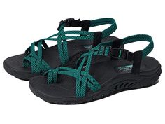 SKECHERS Reggae - Irie Mon - Women's Shoes : Black/Teal : The SKECHERS Reggae - Irie Mon sandal boasts comfort and eye-catching style with a river-style design, woven straps, and an open toe. Stretch fabric upper material. Quick-access buckle closure at the ankle. Adjustable side tab offers a custom fit. Breathable fabric strap lining. Contoured and cushioned insole lends to all-day comfort. Shock-absorbing midsole. Flexible rubber traction outsole. Imported. Measurements: Weight: 8 oz Product m Summer Slingback Sandals With Adjustable Buckle, Adjustable Slingback Sandals With Buckle For Summer, Adjustable Buckle Closure Summer Slingback Sandals, Vacation Sandals With Adjustable Strappy Design, Green Casual Sport Sandals With Adjustable Strap, Summer Beach Sport Sandals With Buckle Closure, Casual Green Sport Sandals With Adjustable Strap, Green Beach Sandals With Adjustable Strap, Green Casual Sandals With Adjustable Straps