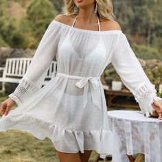 Step into summer with elegance and style with our Chic Net Yarn Tassel Beach Dress Cover-Up. Perfect for the fashion-forward woman, this cover-up combines comfort, style, and functionality, making it an essential for any beach day or poolside relaxation. Key Features Material: Crafted from high-quality acrylic, ensuring a lightweight and breathable feel. Pattern: Elegant solid design that offers a chic and timeless look. Style: Designed in an 'Office Lady' elegant fashion style, this cover-up is not just for the beach but versatile for any summer occasion. Size: 29,9'' length, 43,3'' bust, 55,1'' waist, 63'' hip, 20,5'' sleeve. Benefits Versatility: Ideal for beach outings, pool parties, or as a stylish summer tunic over casual outfits. Ease of Care: Acrylic fabric ensures easy washing and Chic Tunic Cover-up For Beach Season, Chic Mini Length Cover-up For Vacation, Beachy Mini Length Cover-up For Beach Party, Spring Summer Dress With Back Tassel Tie-up, Chic Cover-up For Resort Season Vacation, Beach Season Dresses With Back Tassel Tie-up, Summer Beachwear Cover-up With Tassels, Beachy Mini Sundress For Beach Cover-up, Summer Beach Dress With Back Tassel Tie-up For Vacation