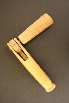 a wooden handle for a pen on a table