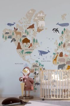 a baby's room with a wall mural and crib in the foreground