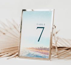 a table number is displayed in front of palm fronds