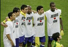 a group of men standing next to each other on a soccer field