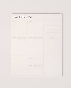 the weekly list is shown on top of a white paper with black writing in it