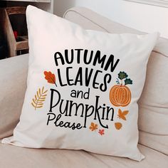 a white pillow that says autumn leaves and pumpkins please on it sitting on a couch