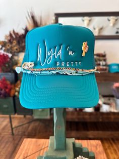 All the cool kids are wearing our Wyld 'n Pretty Trucker Hats! Add some embroidered patches or enamel pins for some extra flair! One size fits most. Trucker Hat Ideas, Daisy Hat, Bison Art, Hat Bar, Custom Trucker Hats, Western Outfit, Hat Patches, Hat Ideas, Vinyl Shirts