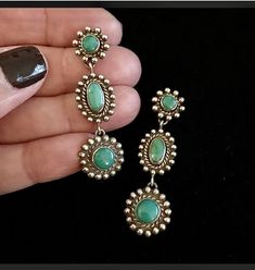 These beauties were created using Vintage Fred Harvey pieces from the 40's. Each piece was originally a screwback earring. Putting them together like this makes a gorgeous more wearable pair of earrings!  They are so lovely on!  also, the color of the turquoise is richer in person. sometimes it's hard to catch the exact color via photos! Each earring measures 2" long and 1" at the widest point. They are in wonderful condition. Stunning one of a kind wearable art! ALL SALES FINAL so please let me Green Retro Jewelry For Anniversary, Vintage Single Round Earring, Heirloom Sterling Silver Jewelry With Matching Earrings, Retro Green Jewelry For Anniversary, Turquoise Jewelry With Matching Earrings For Anniversary, Vintage Collection Dangle Jewelry With Matching Earrings, Retro Turquoise Jewelry, Retro Jewelry With Matching Earrings For Vintage Collection, Retro Handmade Oval Jewelry