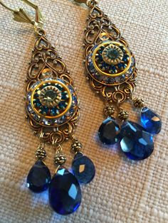 Europeen Brass Filigree Pendant with Vintage Swarovski Deep Blue Crystal Earrings. Kashmir Blue Quartz Briolettes. Leverback Closure.   Size   :     2  3/4 inches    (7cm) Formal Jeweled Blue Earrings, Elegant Jeweled Blue Crystal Earrings, Blue Nickel-free Elegant Chandelier Earrings, Elegant Blue Jeweled Crystal Earrings, Blue Jeweled Teardrop Earrings, Elegant Blue Nickel-free Chandelier Earrings, Elegant Blue Jeweled Earrings, Blue Jeweled Dangle Jewelry, Blue Jeweled Dangle Crystal Earrings