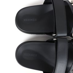 This pair of Chypre Techno sandals are in Black calfskin leather with palladium hardware, have iconic Medor palladium studs, black rubber sole, and an adjustable strap.Origin: ItalyCondition: New and never wornAccompanied by: Hermes box, dustbags, ribbonSize: 37.5 EU Luxury Calf Leather Slides With Buckle Closure, Designer Calf Leather Sandals With Studded Outsoles, Luxury Calf Leather Slides With Leather Footbed, Luxury Slides With Leather Footbed And Calf Leather, Luxury Slides With Calf Leather Footbed, Luxury Black Slides With Buckle Closure, Luxury Black Slides With Leather Sole, Luxury Calf Leather Slides With Removable Insole, Leather Open Toe Slides With Studded Rubber Outsoles