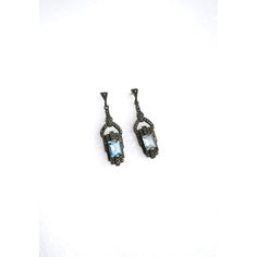 A beautiful pair of blue aquamarine gemstone and sterling silver drop earrings in the Art Deco style, circa late-20th century. Earrings are for pierced ears. Very Good condition as shown in images. No issues. Marked '925' for sterling silver on back of both as shown in last image. A beautiful pair to dress up or down. Dimensions: 1.88" Long Deco Blue, Sterling Silver Drop Earrings, Aquamarine Gemstone, Aquamarine Blue, Silver Drop Earrings, Art Deco Style, Pierced Ears, Deco Style, Art Deco Fashion