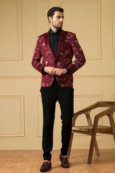 Burgundy blazer in velvet finish with front button closure and thread embroidery. Comes with trouser.
Components: 2
Pattern: Embroidered
Type Of Work: Thread
Neckline: Lapel collar
Sleeve Type: Full
Fabric: Italian ethnic fabric, Velvet finish
Color: Maroon
Other Details: 
Closure : Blazer - Front button
Note : Shirt worn by the model is not for sale.
Occasion: Cocktail and Reception - Aza Fashions Festive Embroidered Tailored Blazer, Formal Tailored Blazer With Floral Embroidery, Semi-formal Embroidered Notch Lapel Blazer, Tailored Floral Embroidered Blazer For Formal Occasions, Single Breasted Long Sleeve Festive Suits, Festive Single-breasted Long Sleeve Suits, Formal Blazer With Floral Embroidery And Long Sleeves, Formal Long Sleeve Blazer With Floral Embroidery, Winter Formal Blazer With Floral Embroidery