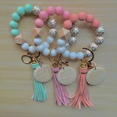 Looking for cute mama bangle keychains for your MAMA?  Look no more! This wristlet keychain is made of sturdy silicone and SO CUTE.  The keyring is made of alloy gold, including a metal tassel and hook.  The bracelet style key chain is elastic and one size fits most!   🌟What makes it so great?  - VIBRANT colors -long tassel size - super soft silicone feels so comfy on wrist  - high quality metal/materials  - mama keychain adds the cutest personalized touch for any mom or mom-to-be  🌈What colors do they come in?  - Mint green - Pink  - Purple - Peach - Blue  - Black 🎀There's a color for any MAMA out there she's sure to love! 🎀 🗳️Dimensions:  Total length 7.9"  Universal fit for one size fits most!  🥳The perfect gift for any occasion! Birthday Valentines Day Baby Shower Christmas  Than Adjustable Key Bracelets As Gift, Trendy Wristlet With Keychain For Gift, White Wristlet With Keychain As Gift, Pink Wristlet With Lobster Clasp For Gifts, Silicone Wristlet Keychain, Multicolor Keychain Wristlet For Everyday Use, Mama Silicone Wristlet, Hot Pink Silicone Bead Key Ring, Silicone Bead Wristlet 15mm