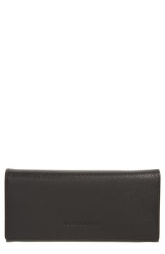 Softy grained texture showcases the minimalist design of a classic Longchamp wallet crafted from leather. Leather Imported Luxury Wallets With Grained Texture For Formal Occasions, Formal Leather Wallet With Grained Texture, Elegant Leather Wallet With Grained Texture, Textured Leather Wallets For Formal Occasions, Formal Textured Leather Wallet, Classic Black Wallet For Work, Classic Textured Leather Wallet For Business, Classic Textured Leather Business Wallet, Classic Textured Leather Evening Wallet