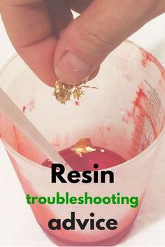 a hand is dipping something into a bowl with the words resin troubleshooting advice