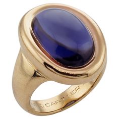 This gorgeous authentic Cartier ring is crafted in 18k yellow gold and bezel-set with an oval purple iolite. Made in France circa 1994. Measurements: 0.47" (12mm) width, 0.86" (22mm) length. The ring size is 6.25 - EU 53. Resizable. Sizing fees will be provided upon request. Excellent condition. Comes with original box. Vintage Cartier Watch, Yellow Gold Cocktail Ring, Iolite Stone, Ring Video, Gold Cocktail Ring, Gold Cocktail, Diamond Cocktail Rings, Vintage Cocktail, 18k Yellow Gold Ring