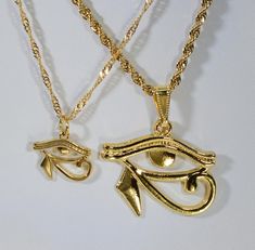 "24 kt Gold-plated Eye of Ra in TWO size options Buy (1) or BOTH! 24 kt GOLD Egyptian Eye of Ra Charm Necklace ❤ Valentine Gift ❤ Birthday Gift ❤ Gift for Mom and /or Son ❤ RA charms are made of Stainless steel and then Gold-plated. FROM OUR PULL-DOWN MENU CHOOSE YOUR SIZE: LARGE ❤ {1} Large 24kt gold-plated EYE of RA charm Measures 30mm/ 1.25 \"wide by 25mm/ 1\" tall Strung on 2mm stainless steel ROPE chain 50cm/ 19.7 inches with lobster clasp. OR SMALL ❤ {1} Smaller 24kt gold-plated Eye of RA Moon Phase Jewelry, Dope Jewelry Accessories, Twins Gift, Egyptian Eye, Eye Of Ra, Egyptian Jewelry, Jewelry Accessories Ideas, Dope Jewelry, Jewelry Fashion Trends