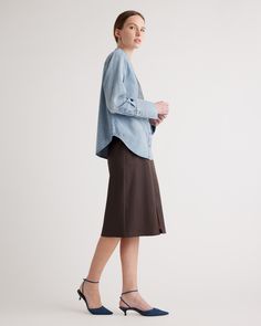 All eyes on that pleated placket! Our Distressed Denim Tuxedo Shirt features a few dressier touches, including the aforementioned pleats, a chic band collar, and elongated cuffs. An easy match for your favorite colored pant or a denim-on-denim outfit.  | Quince | Women's Distressed Denim Tuxedo Shirt in Blue, Size Medium, Cotton Denim Tuxedo, Chic Band, Tuxedo Shirt, Tuxedo Shirts, Colored Pants, Flowing Skirt, Mink Pink, Band Collar, Denim Outfit