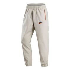 Men's Nike Woven Logo Printing Sports Pants/Trousers/Joggers Autumn White DR7832-072 (Sports Trousers) Casual Outdoor Tracksuit With Pockets, Casual Tracksuit With Pockets For Outdoor, Nike Casual Sweatpants For Outdoor, Nike Joggers With Pockets For Streetwear, Nike Athleisure Joggers For Outdoor, Cotton Sportswear Joggers For Outdoor, Sporty Parachute Pants For Leisure, Nike Cotton Cargo Pants For Sports, Nike Sporty Tapered Leg Sweatpants