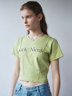 This short-sleeve T-shirt from NICK&NICOLE features the Nick Nicole logo lettering as a focal point. The pintuck detail on the front makes it suitable for statement wear.- Slim fit that makes your body curves accentuated- The cropped length elongating the legs- A versatile item with a vintage yet casual mood Fitted Cropped T-shirt With Logo Print, Green Short Sleeve Cropped T-shirt For Streetwear, Spring Logo Print Short Sleeve Tops, Green Cropped T-shirt With Short Sleeves For Streetwear, Green Short Sleeve Cropped T-shirt For Spring, Fitted Short Sleeve Tops With Logo Print, Green Cropped Short Sleeve T-shirt With Letter Print, Logo Print Short Sleeve T-shirt For Spring, Green Short Sleeve Top With Logo Print