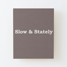 the words slow & stately are written in white on a gray background