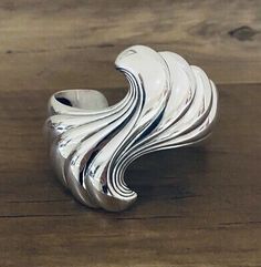 (eBay) Kabana Cuff Bracelet Sterling Silver. Heavy Swirl Bracelet 2 1/2” wide 78.4 grams Fit a medium to large wrist Handmade USA We ship USA only! (No Alaska or Hawaii) Swirl Bracelet, Fine Jewelry Bracelets, Bracelets And Charms, Silver Cuff, Sterling Silver Bracelets, Handmade Silver, Cuff Bracelet, Alaska, Swirl