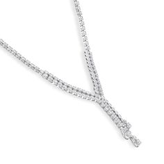 Drape your neck in sparkle and elegant detail when you wear this luxe diamond double-strand chandelier necklace. Created in 14K white gold Diamond-lined double-row ribbons meet in a triple-row "Y"-shaped drop. Pear-shaped diamond composites punctuate each ribbon. Diamonds sparkle in a single row further up the design. Stunning with 2-3/4 cts. t.w. of diamonds This 16.0-inch necklace secures with a box clasp. Formal Double Strand Diamond Necklace, Luxury Double Strand White Gold Necklace, Luxury White Gold Double Strand Necklace, Formal Fine Jewelry Double Strand Necklace, Elegant Double Strand Diamond Necklace, Elegant Double Strand Diamond Necklaces, Elegant Double Strand White Gold Necklace, Formal White Gold Lariat Necklace With 17 Jewels, Elegant Double Strand Necklace For Anniversary