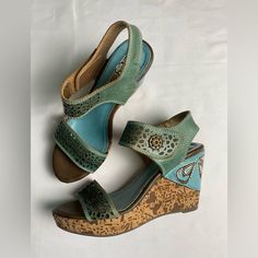 L Artiste By Spring Step Allura Wedge Sandals Size 38 (Us 7.5-8) Color Sky Blue New Without Tags Excellent Condition Approximate Heel Height 3.75” Thanks For Checking Out My Closet! Offers Always Welcomed Bohemian Leather Wedge Sandals, Leather Bohemian Wedge Sandals, Bohemian Platform Wedge Sandals, Turquoise Wedge Heel Sandals For Beach, Blue Open Toe Wedge Sandals With Heel Loop, Summer Sandles, Blue Wedge Sandals, Artistic Shoes, L'artiste By Spring Step