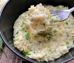 a bowl filled with mashed potatoes and garnished with parsley