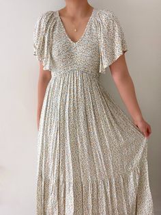 Dress features flutter sleeves, smocked bodice, and tiered silhouette.  Self: 100% Polyester; Lining: 100% Rayon Hand wash cold  Color: Ivory  True to size fit Love Story Dress, Golden Heart Locket, Our Love Story, Heart Locket Necklace, Golden Heart, Skirt Jumpsuit, Heart Locket, Large Bust, Top Sales