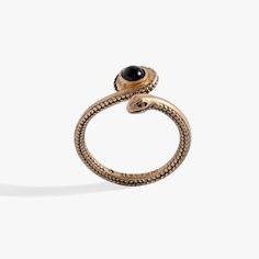 Elevate your style with the bold Untamed Snake Ring, featuring a meticulously crafted gold snake silhouette wound around a black bead. The snake, a powerful symbol of transformation, renewal and protection, adds a touch of intrigue to this powerful piece. Wear the snake as a reminder of your inner strength and the constant evolution of your personal journey. Snake Silhouette, Jewelry Style Guide, Glam Gifts, Snake Ring, Personal Journey, Gold Snake, The Snake, Charm Rings, Charm Bangle