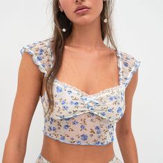 For Love And Lemons Lottie Top Blue White Floral Xl New Condition: New In Package Size: Xl Color: Blue/White Floral Delicate Calico Florals Mingle Femininity And Romance. Lined Cups Add Comfort Alongside A Sweet Ruffle Trim. Shearing Accent Lined Lettuce Edge Hem Lace Trim Lettuce Edge Cap Sleeves Machine Wash Imported White Blouse Crop Top, Lace Bustier Top, White Lace Crop Top, Lemon Top, Backless Crop Top, Crop Top Shirts, For Love & Lemons, Feminine Aesthetic, Crop Top Sweater