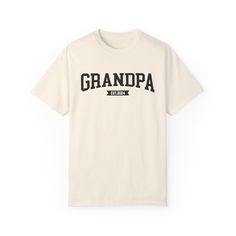 a white t - shirt with the words grandpaa on it in black letters and an arrow