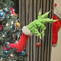 the grinch hat is hanging on the christmas tree