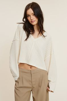 The All The Way Beige Long Sleeve Crop Top delivers both style and comfort! Its beige Pointelle-effect solid-knit fabric shapes a V-neckline top that features an oversized cropped bodice, exposed seams, drop shoulders, and long sleeves. The relaxed silhouette pairs perfectly with jeans and trousers! DETAILS & FIT Oversized Fit. 97% Polyester, 3% Spandex. Model is 5'8" 33-24-35 wearing a size Small. Machine wash cold. Imported. Loose Crop Top, Oversized Crop Top, Beige Long Sleeve, Trousers Details, Exposed Seams, Beige Top, Pink Boho, Shipping Orders, Long Sleeve Crop